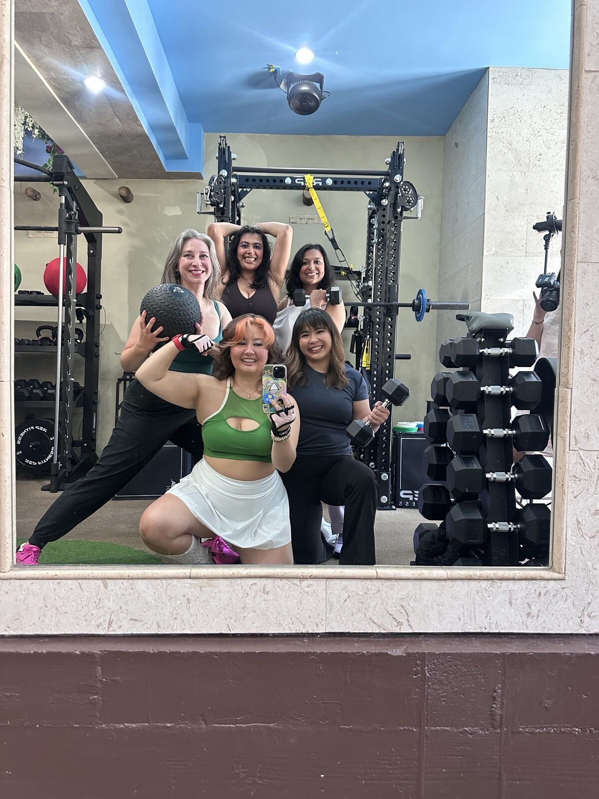 A group session in the mirror at the gym