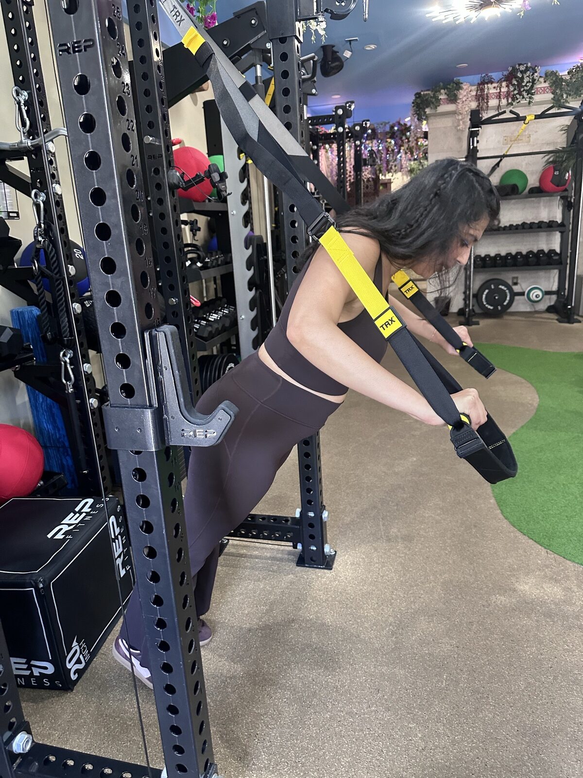 Erica demonstrating a TRX row
